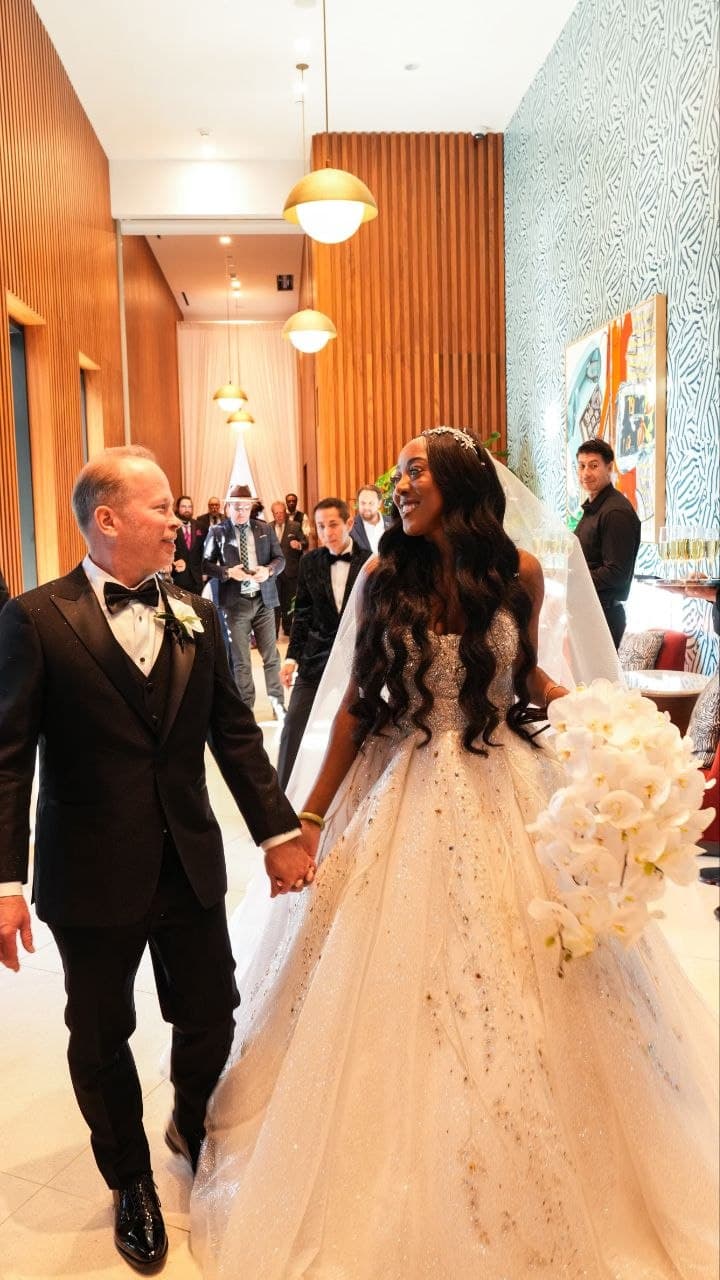 Bride and groom walking into their luxury Dallas hotel wedding