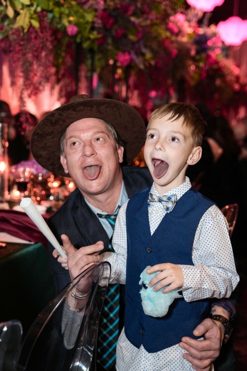 Playful candid moment at Dallas wedding reception